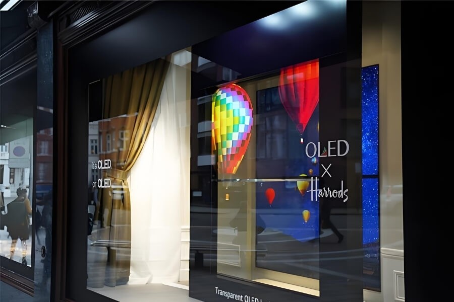 Large-scale transparent OLED display wall used in commercial and retail applications
