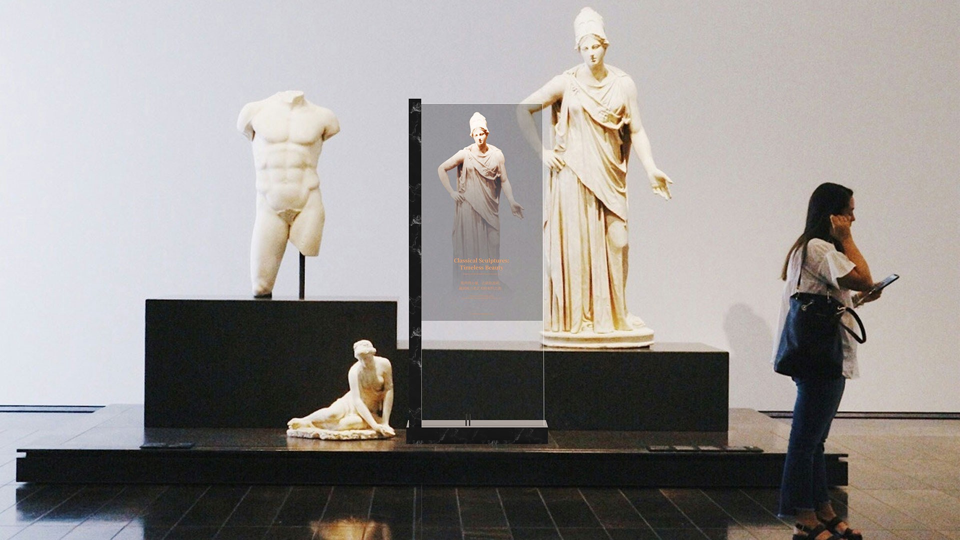 Transparent OLED display presenting digital content in front of classical sculptures in a museum