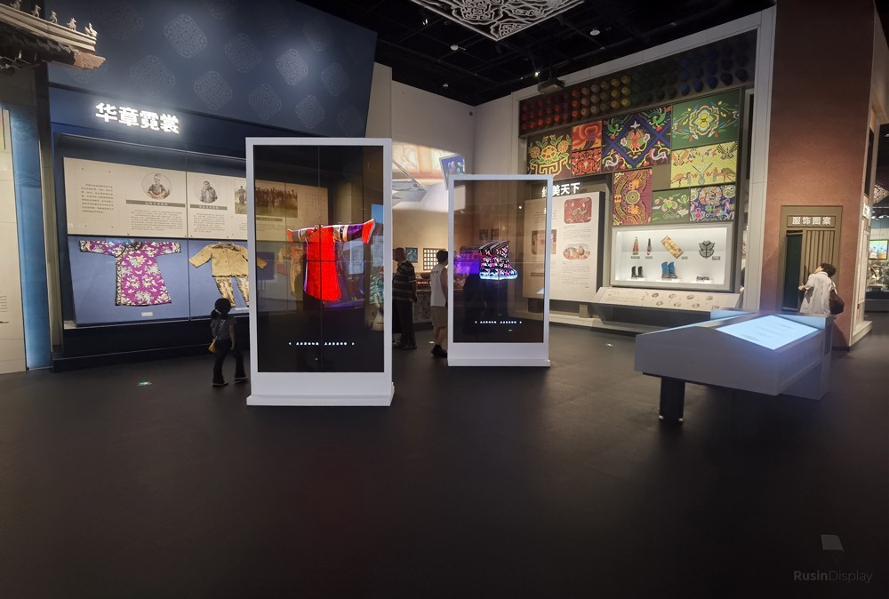 Transparent OLED display presenting traditional costumes at an Inner Mongolia cultural heritage exhibition